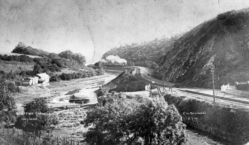 Railway line and train travelling toward Rosemarket, at Westfield Crossing (Neyland)